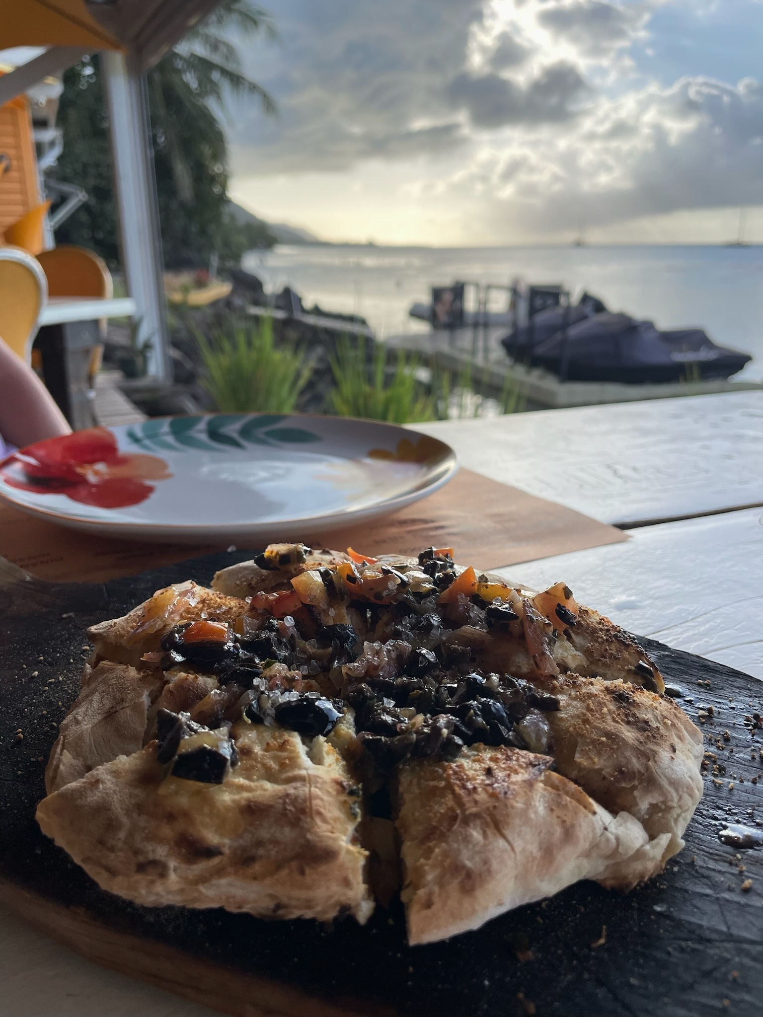 A starter on our waterfront table at Moorea Beach Cafe, with the lagoon behind