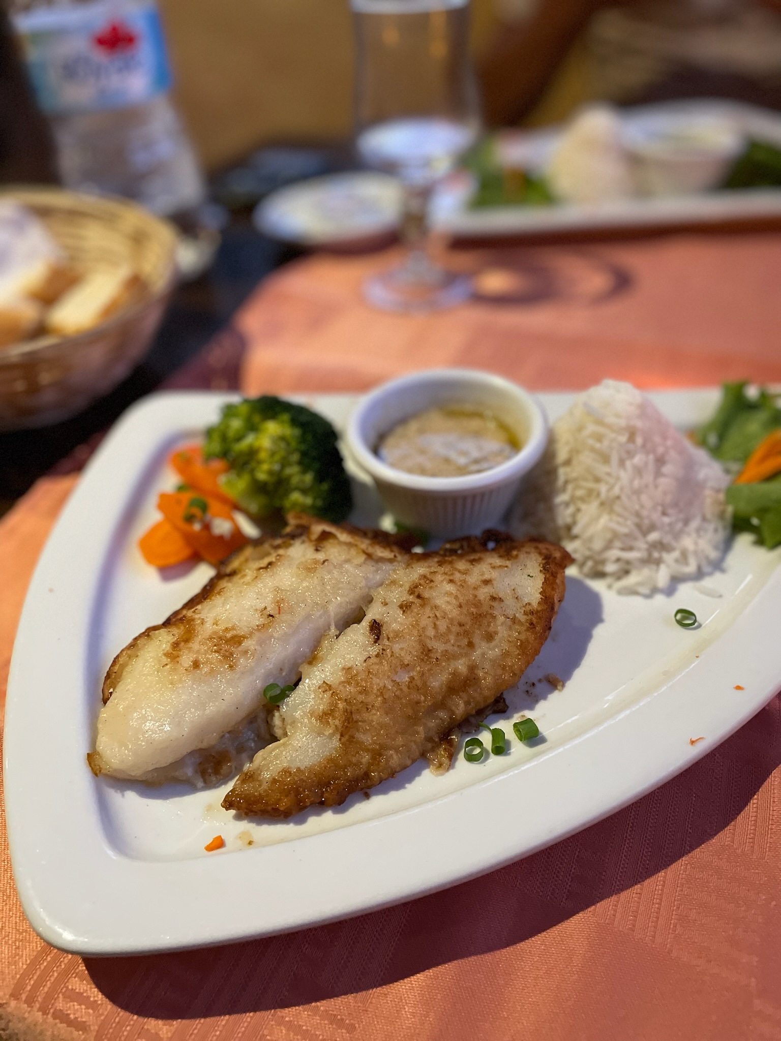 Pan-cooked fish with sauce, rice and vegetables at Rudy's, Moorea