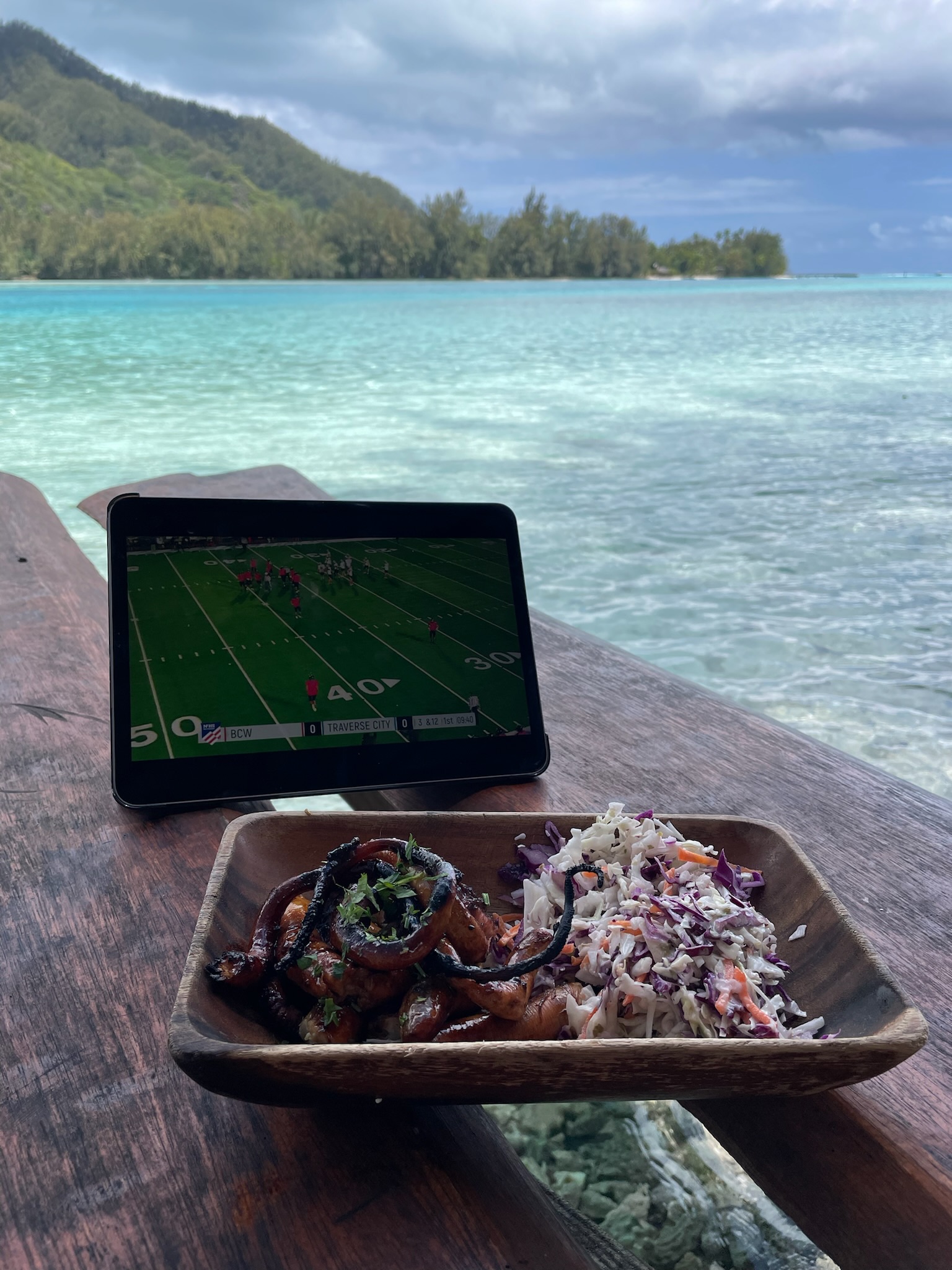Grilled octopus at Coco Beach, Moorea, on a table over the lagoon