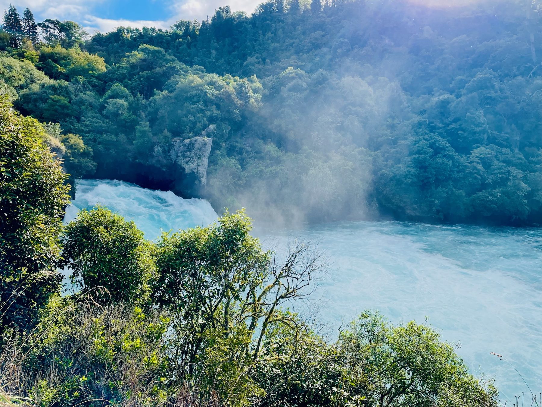Huka Falls throwing up mist in the late afternoon sun, Taupo